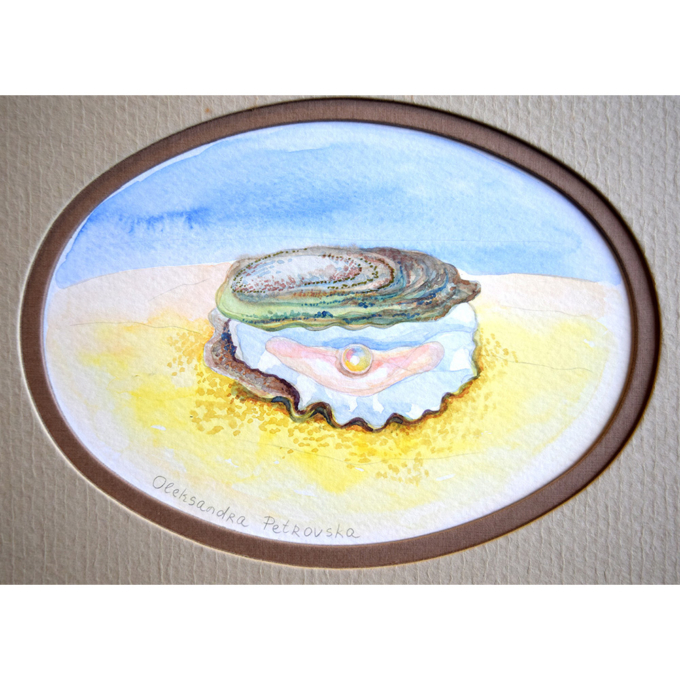 Oyster with pearl on the beach